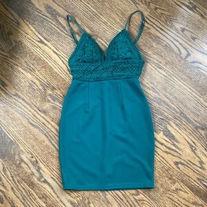Emerald green mini dress with crocheted details